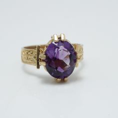 Amethyst Cocktail Ring 14k Gold  Amethyst Estimated Weight 2.63ct Ring face is 12.37mm across by 11.2mm wide by 6.47mm in height Ring weight 3.3 grams Ring size 6 can be sized at a low cost Comes with a new ring box Item Number 5383 Oval Amethyst Ring With Diamond Cut, Oval Diamond Cut Amethyst Ring, Oval Diamond Cut Yellow Gold Amethyst Ring, Oval Amethyst Ring In Yellow Gold With Diamond Cut, Formal Oval Amethyst Ring With Diamond Cut, Formal Purple 14k Gold Rings, Vintage Amethyst Ring, Amethyst Cocktail Ring, Amethyst Ring Vintage