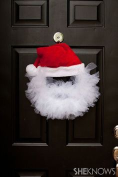 santa tulle wreath on the front door with text overlay that reads, santa tulle wreath