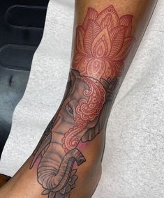 an elephant tattoo on the arm of a man