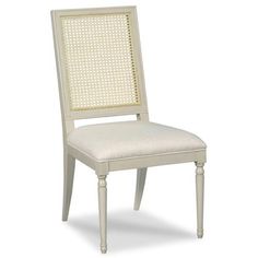 a white chair with a beige upholstered back and seat cushion on an isolated white background