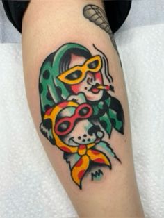 a woman with a mask on her face and a fish in her mouth tattoo design