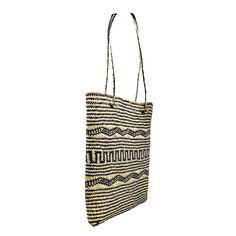 The perfect market tote, small beach bag, or everyday summer purse! 100% Handwoven Straw Tote Beautiful Black and Natural Motif Design Tote Body Height: 11" Bottom of Tote: Length 7" x Width 7" Top Opening of Tote: Length 9" x Width 8" Woven Handle Height: 11.5" Tall Total Tote Height, Body + Woven Handle: 21.5" Handmade by talented women artisans in Bali, and sustainably sourced with care All POPPY + SAGE totes come with our signature linen dust bag, a premium added touch to protect your tote w Fair Trade Everyday Jute Bags, Daily Use Palm Leaf Tote Beach Bag, Black Natural Fiber Beach Bag For Daily Use, Eco-friendly Fair Trade Bucket Beach Bag, Eco-friendly Natural Straw Market Bag, Casual Natural Shoulder Bag With Fair Trade Details, Fair Trade Tote Bag For Vacation, Casual Natural Shoulder Bag Fair Trade, Everyday Palm Leaf Tote Beach Bag