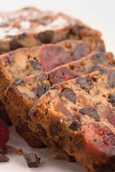 two pieces of chocolate chip banana bread with cherries