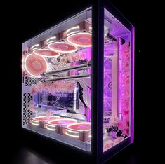 the inside of a computer case is lit up with pink flowers and plates on it