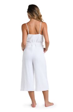 Packed itinerary? Be sure to schedule a date with this white jumpsuit cover up. The perfect travel companion, this sexy number has a V-neck front and lingerie straps for figure-flattering style. Looks just as fabulous with heels as it does with sandals. [split] Details Jumpsuit cover up Adjustable straps Crochet side panel detail Wide legs, cropped length Belted Side pockets Fully lined Fabric 100% Cotton Chic Jumpsuits And Rompers With Adjustable Straps For Vacation, Loungewear Jumpsuits And Rompers With Spaghetti Straps, Loungewear Jumpsuits With Adjustable Spaghetti Straps, Spaghetti Strap Jumpsuits For Loungewear, Vacation Jumpsuits And Rompers With Adjustable Straps, Jumpsuits And Rompers With Adjustable Straps For Vacation, Beachwear Jumpsuits And Rompers With Tie Waist, Chic Beach Jumpsuits And Rompers With Adjustable Straps, Vacation Jumpsuits And Rompers With Spaghetti Straps