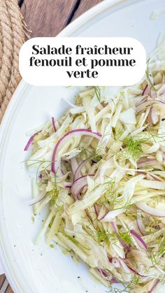 a white plate topped with cabbage and fennel