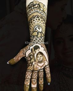 a woman's hand painted with hendi designs