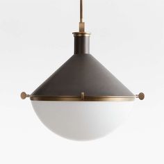 a white and gold pendant light hanging from a ceiling