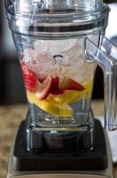 a blender filled with fruit and ice