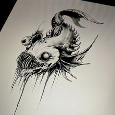 a black and white drawing of a dragon's head