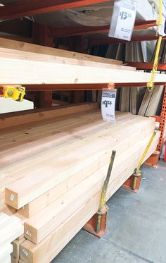 the shelves are full of wooden boards for sale