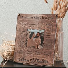 a wooden photo frame with the words 12 reason why i love you