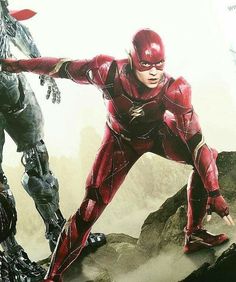 the flash and cy - man are standing in front of each other on top of a mountain