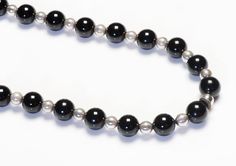 Tiffany & Co. Silver Onyx Bead Necklace.Vintage necklaces by Tiffany & Co. Length 28 inches. Onyx beads measuring 10 mm each. Signed Tiffany & Co. 925. Classic Black Beaded Necklaces, Classic Onyx Necklace With Black Beads, Genuine Love, Vintage Necklaces, Onyx Bead, Necklace Vintage, Bead Necklace, Tiffany & Co., Vintage Necklace