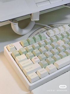 a computer keyboard sitting on top of a desk