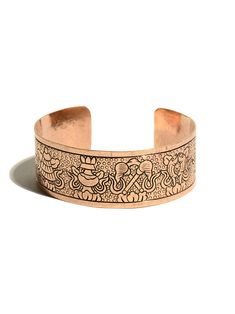 Tibetan copper bracelet inscribed with the Eight Auspicious Symbols. Copper is a soft metal and the bracelet can easily be shaped to fit most wrist sizes. These symbols are very popular in Tibet and known in Sanskrit as Ashtamangala. The Eight Auspicious Symbols are Umbrella or Parasol, Golden Fish, Treasure Vase, Lotus, Conch Shell, Endless Knot, Victory Banner and Dharma-Wheel. Made in Nepal.