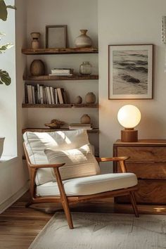 a living room filled with furniture and bookshelves next to a wall mounted shelf