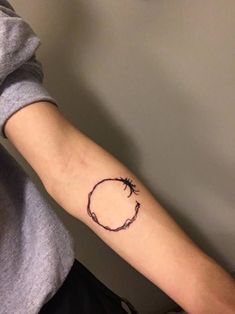 a person with a small tattoo on their arm