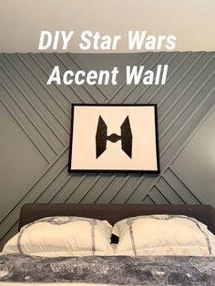 a bed with white sheets and black headboard in front of a star wars accent wall