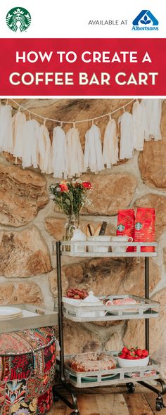 a coffee bar cart sitting in front of a stone wall with clothes hanging on it