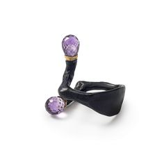 This designer silver ring, plated with our proprietary deep-black Black Anthracite coating, features subtle gold accents at the ends of the open band, each cradling two natural Amethyst briolettes. Organic and unconventional, this piece is perfect for those who embrace freedom of self-expression and artistic flair. Please Note: Natural gemstones may appear different under various lighting conditions. For the most accurate representation, refer to the model photo. Metal: 925 Silver Stones: Amethyst Plating: Black Anthracite, 18K Gold August Birthstone Jewelry, July Birthstone Jewelry, Fine Art Jewelry, Zodiac Jewelry, Jewelry Ring Box, Pearl Jewellery Earrings, Men's Jewelry Rings, Evil Eye Jewelry, August Birth Stone