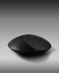 a black bowl sitting on top of a table