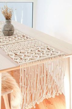 a table with a white runner on top of it