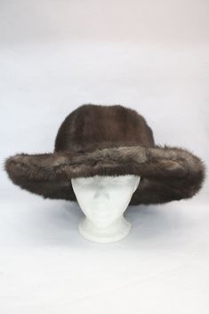 REFURBISHED NEW AND VERY STYLISH LUTETIA MINK FUR HAT FOR MEN & WOMEN! IT IS ACCENTUATED WITH DARK RANCH MINK FUR INSERT AROUND THE CROWN. THIS HAT IS REFURBISHED NEW, MADE TO MEASUREMENT! SIZE: CUSTOM MADE PLEASE LET US KNOW YOUR HEAD CIRCUMFERENCE INCLUDING THE TIP OF EARS. CRE1898 Oliverfurs 9250 Parc Ave. #204, Montreal, Quebec, H2N 1Z2, Canada www.oliverfurswholesale.com oliver@oliverfurswholesale.com Toll free: 1-866-845-9997 International: 1-514-845-9997 Fur Hat Men, Raccoon Fur Coat, Fox Fur Jacket, Coyote Fur, Long Coat Jacket, Mink Fur Coat, Fur Blanket, Hat Men, Montreal Quebec