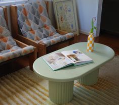 a living room with two chairs and a coffee table