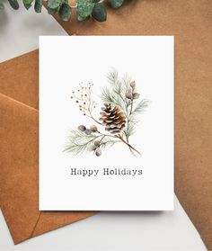 a card with the words happy holidays written on it and pine cones in the background