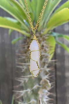 "Beautiful gold wire wrapped rose quartz crystal point pendant on gold plated chain with lobster claw closure. The pendant is approximately 1.25\" long and 0.4\" wide. Please note that all crystals are unique and therefore color, shape and size may vary slightly. Please choose a necklace length from the drop-down menu. In case you would like a length other than the listed options, leave us a note at checkout. Item will be shipped 1 - 2 business days after purchase. \"The fair and lovely Rose Qua Gold Wire Wrapped Crystal Necklace For Gift, Handmade Gold Crystal Necklace With Rose Quartz, Gold Wire Wrapped Rose Quartz Jewelry, Adjustable Gold Rose Quartz Crystal Necklace, Gold Rose Quartz Wire Wrapped Necklace, Gold Wire Wrapped Rose Quartz Necklace, Gold Wire Wrapped Crystal Pendant Necklace, Gold Wire-wrapped Pendant Crystal Necklaces, Gold Wire-wrapped Rose Quartz Necklace