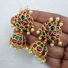 "These Jhumka Earrings set has an excellent finish and gives out an exquisite sense of style. If you are looking for an amazing Fashion Jewelry set for special occasions such as Anniversary, Engagement, Party, Wedding, or for gifting, then your search ends here. Handmade Indian Temple Jewelry, best to wear it for traditional ceremonies or Indian wedding. This bridal jewelry has an ethnic finish. It has Cubic Zircon stones with semi-precious ruby and emeralds. It is a Bollywood style one gram jew Gold Plated Hand Set Jhumkas In Temple Jewelry Style, Gold Plated Hand Set Jhumkas Temple Jewelry, Hand Set Gold Plated Temple Jewelry Jhumkas, Gold Plated Hand Set Temple Jhumkas, Bollywood Style Gold Plated Hand Set Jhumkas, Bollywood Style Hand Set Gold Plated Jhumkas, Round Danglers For Puja And Diwali, Festive Round Danglers For Puja, Festive Hand Set Gold Plated Jhumkas