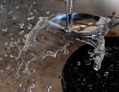 a water faucet that is pouring out of it's spigot