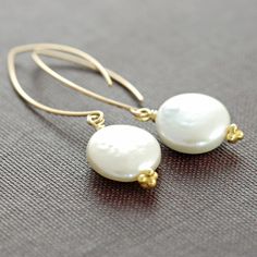 Coin Pearl Earrings in 14k Gold Fill, Handmade. $22.00, via Etsy. Nickel-free Yellow Gold Pearl Earrings, Nickel-free Yellow Gold Round Pearl Earrings, Yellow Gold Nickel-free Pearl Earrings, 14k Gold-filled Round Pearl Earrings With Charm, Classic Adjustable Gold Pearl Earrings, White Round Pearl Earrings In 14k Gold Filled, Dainty Round Pearl Earrings With Ear Wire, White 14k Gold Filled Round Pearl Earrings, White 14k Gold Filled Pearl Earrings