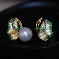 💚💚 Specifics: Materials: Natural freshwater Pearl With 925 Silver And Zircon Earrings Size: 12mm*22mm Pearl Diameter: 10mm*10mm Closure: the closure is made of 925 sterling silver.  Handmade Artwork, original design and copyright protected  Metal: Gold plated s925 silver 💚💚Shipping We ship it in 5-7 days after the payment is made and you may choose your personalized shipping services. We shipping world wide and it is free international shipping. Please kindly be reminded that we are not resp Elegant Green Pearl Earrings Gift, Green Pearl Earrings For Anniversary, Pearl Clip-on Earrings As Gift, Green Pearl Earrings For Wedding, Green Pearl Earrings For Gift, Green Pearl Earrings As Gift, Elegant Green Pearl Earrings For Pierced Ears, Fine Jewelry Green Pearl Earrings For Gift, Pearl Studs Earrings