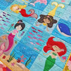 the quilt is made to look like mermaids