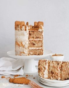 two pieces of cake sitting on plates next to each other with one slice cut out