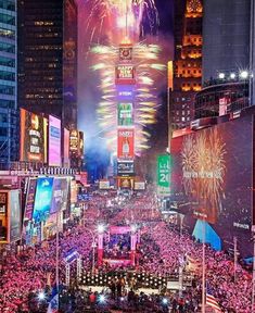 fireworks are lit up the night sky above new york city's times square