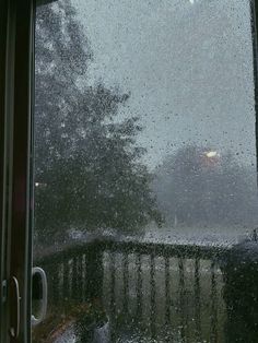 the rain is falling down on the window