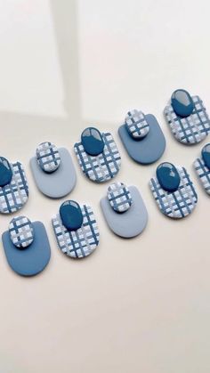 blue and white buttons are arranged on a table