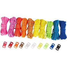 several different colored cords and clips on a white background