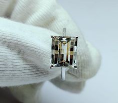 Netural crystal gemstone, pixel cut,rectangle Shape,engagement ring, anniversary gift, fantasy cut stone ring, Stone - neutral crystal gemstone  Ring Weight - 3 to 4.5 gram  Stone size - 9×11  mm Luster - Transparent  Ring size - 7 US to all US size  Material - 925 sterling silver  Code -  Az288 Gift Topaz Ring With Prong Setting And Rectangular Stone, Gift Rectangular Topaz Ring With Prong Setting, Classic Rectangular White Gold Topaz Ring, Modern Rectangular Topaz Wedding Ring, Formal White Rectangular Ring, White Diamond Cut Square Cut Ring, Diamond Cut Rings With Rectangular Stone, White Rectangular Sterling Silver Ring, Radiant Cut Crystal Ring With Prong Setting For Gift