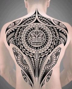 the back of a man with an intricate tattoo design on his body and chest,