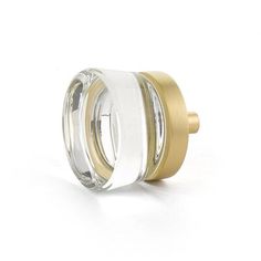 a clear and gold glass knob on a white background