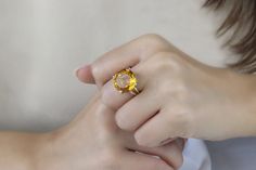 A yellow ring from Anemone that features a round Citrine set 925 Sterling silver double band. This November birthstone ring makes a lovely gift for a loved one or for yourself. Complete your collection of exquisite rings with this 925 Citrine ring. ☛ 𝒜𝐵𝒞 - Add Engraving - https://etsy.me/2ZSRjhu ☛ Ring size - Select the size you would like from the drop down menu ♥ Gemstone Type - Citrine ♥ Gemstone Size - 16mm ♥ Gemstone Cut - Faceted Round ♥ Metal Type (Main Photo) - 925 Sterling Silver - O Yellow Round Topaz Ring With Prong Setting, Elegant Citrine Solitaire Ring, Elegant Solitaire Citrine Ring, Yellow Topaz Ring For Wedding, Yellow Topaz Round Ring, White Gold Citrine Topaz Wedding Ring, Elegant Yellow Citrine Crystal Ring, Elegant Yellow Topaz Ring With Round Cut, Elegant Yellow Topaz Ring Round Cut