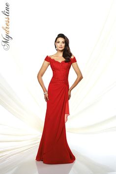 a woman in a long red dress posing for a photo with her hands on her hips