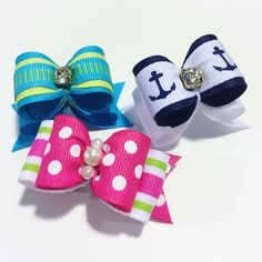 three bows with different colors and designs on them