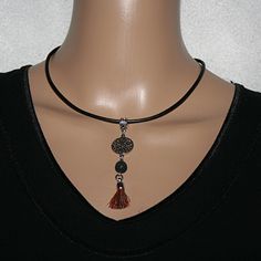 Cool leather necklace with pearls and a mandala pendant, lava bead and tassel. The leather necklace is 2mm wide, black and has a lobster clasp and extension chain.  This necklace is perfect for everyday wear and ideal as a gift for someone special. Spiritual Tassel Necklaces With Adjustable Fit, Adjustable Spiritual Tassel Necklaces, Mandala Pendant, Necklace With Pearls, Necklace With Pendant, Lava Bead, Leather Necklace, Necklace Gift, Gift For Women