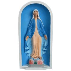 an image of the virgin mary statue on display in a white and blue arch with roses