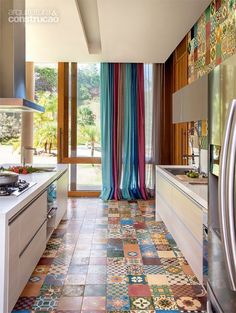 an image of a kitchen with tile flooring